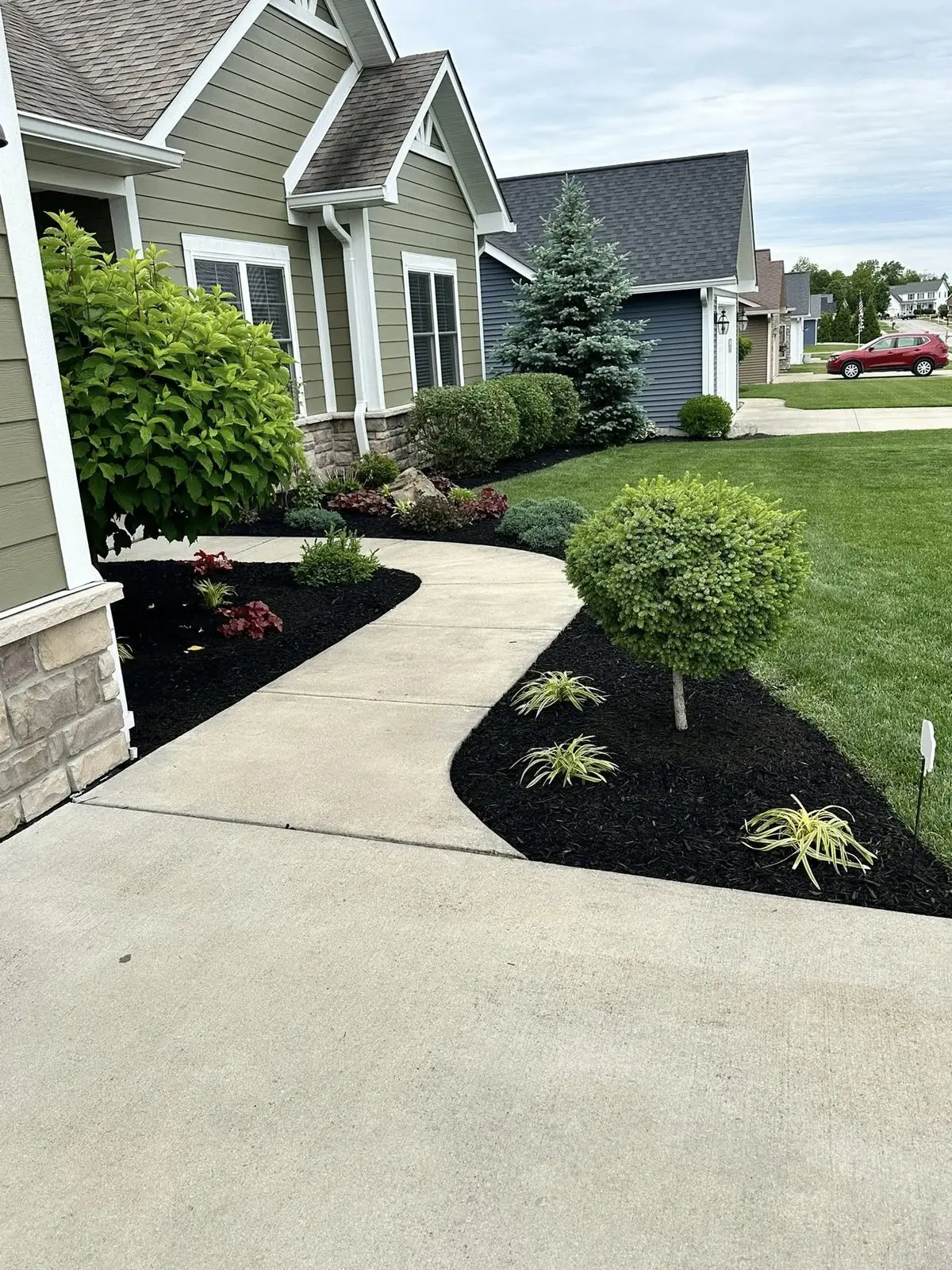 Hardscape walkway with mulch bed landscaping in Bloomington, IN