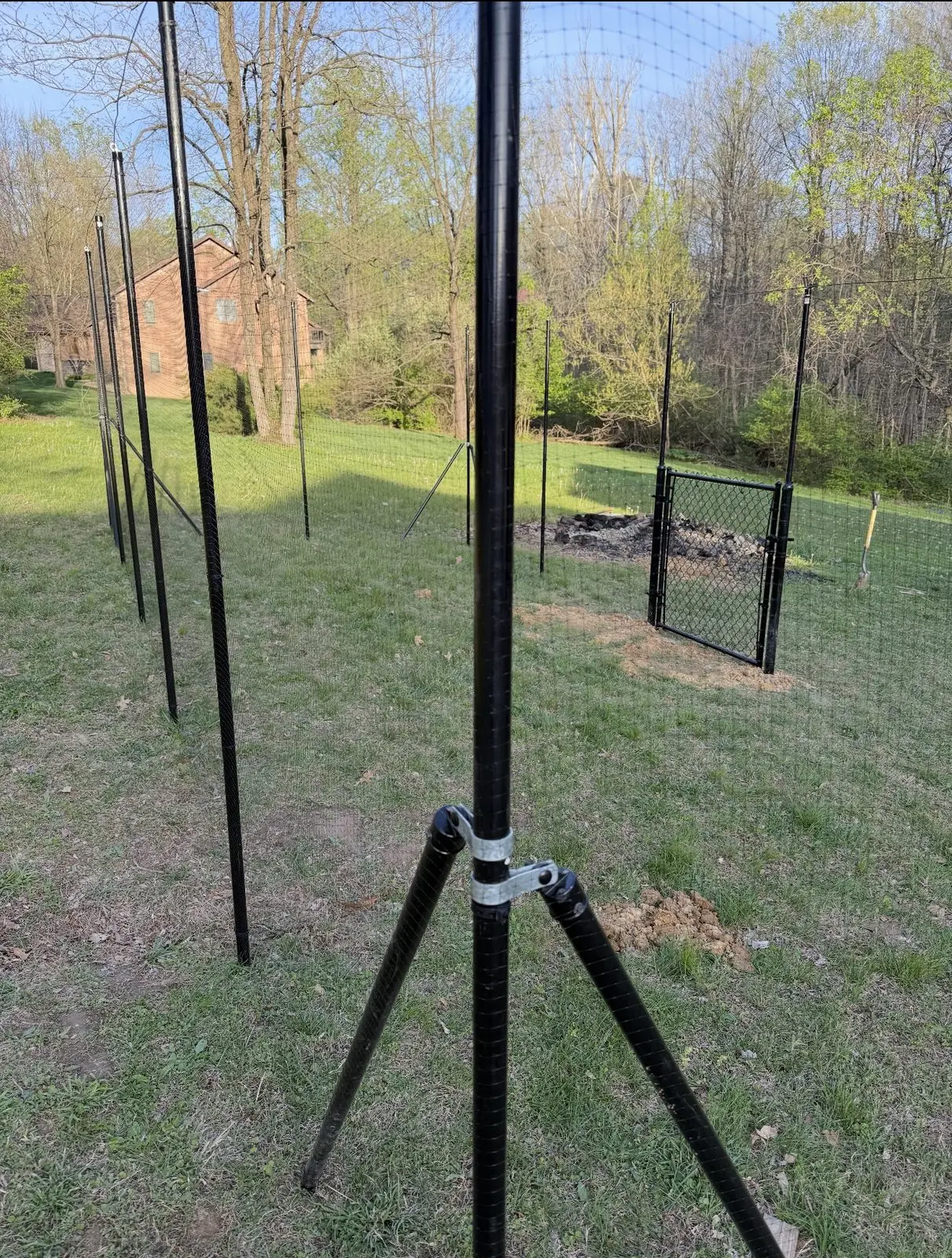 Black welded wire fence with a chain link gate in Bloomington, IN