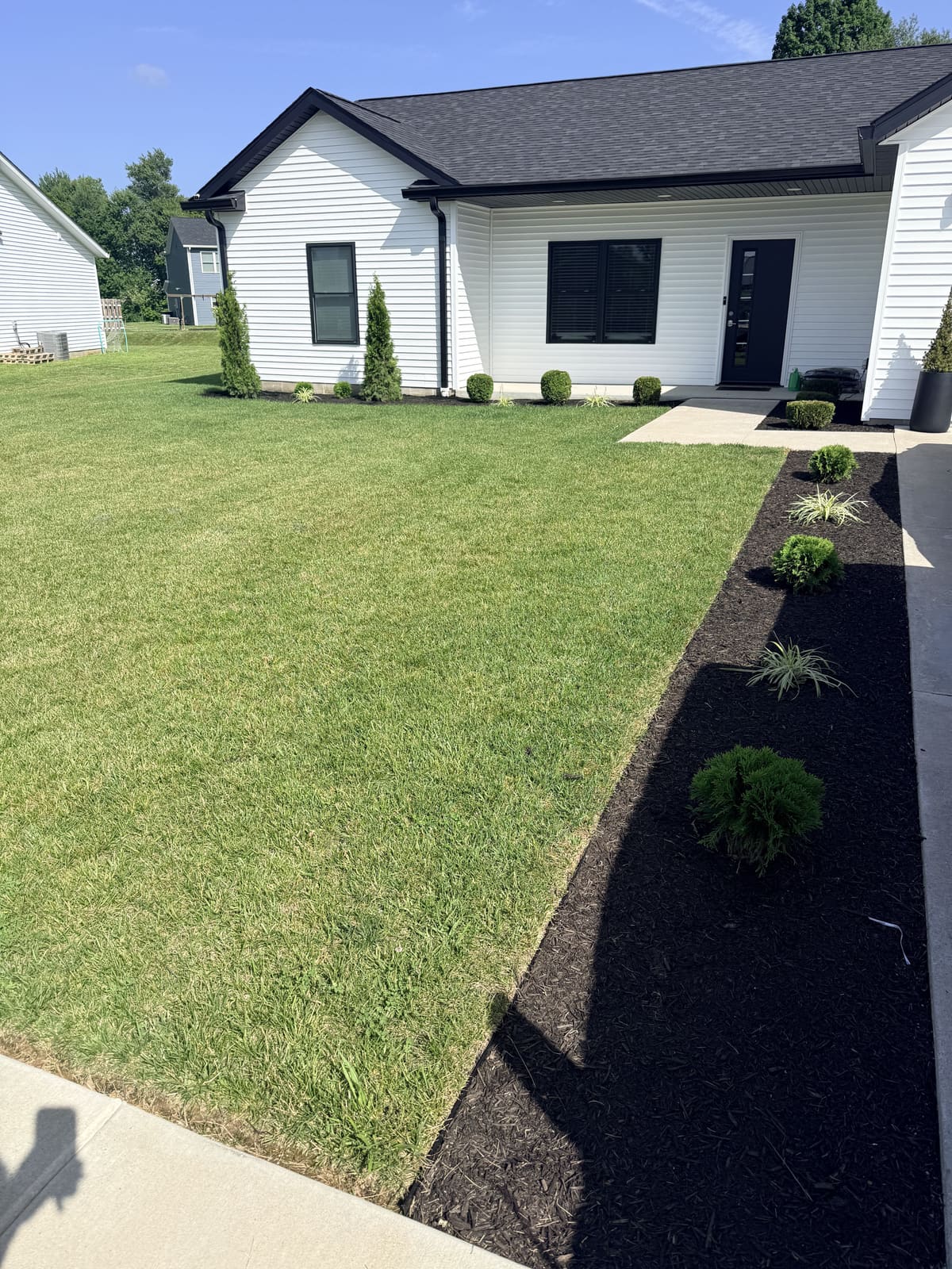 Black mulch landscaping beds at a new construction home in Bloomington, IN