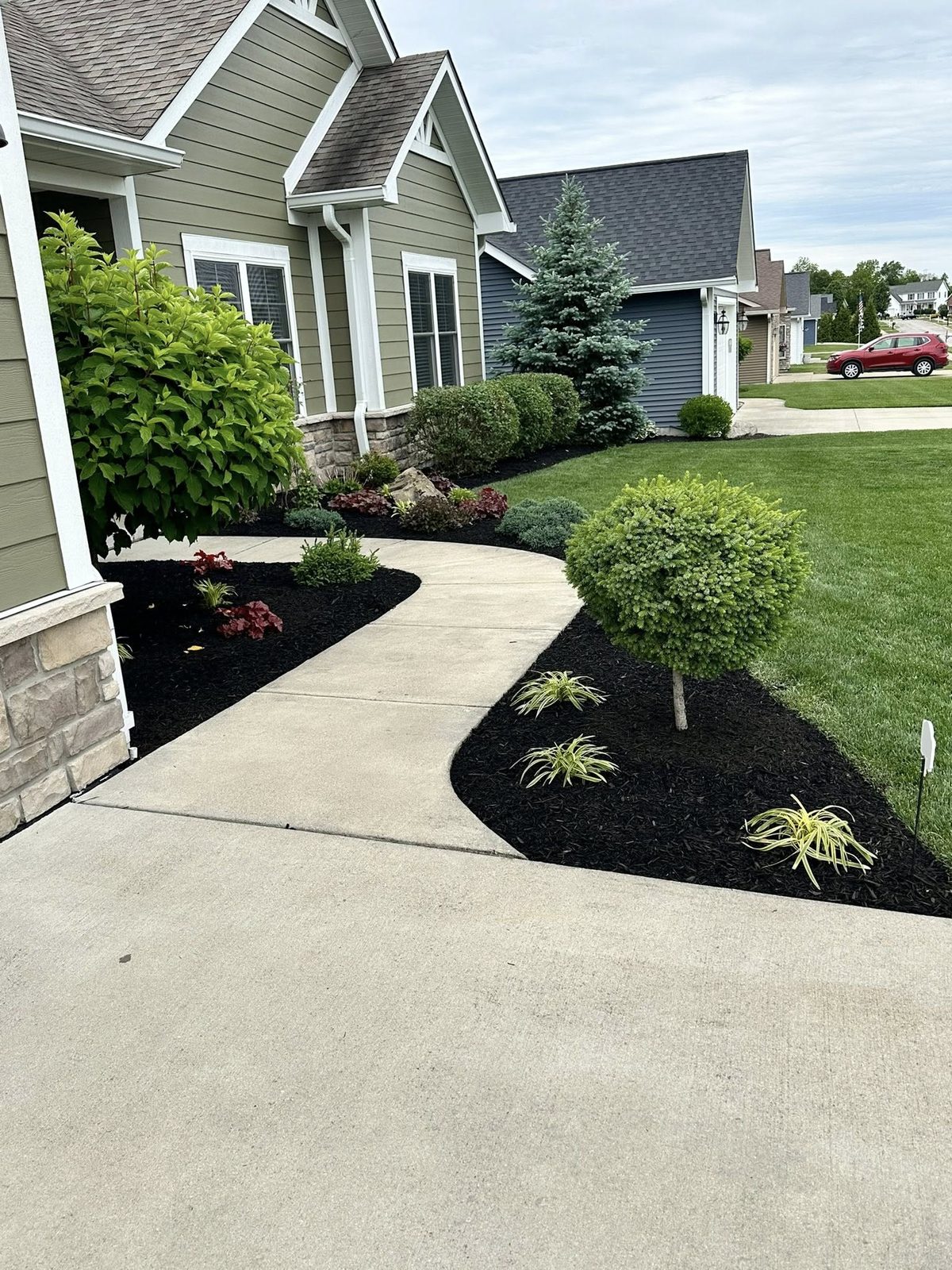 Hardscape walkway with mulch bed landscaping in Bloomington, IN