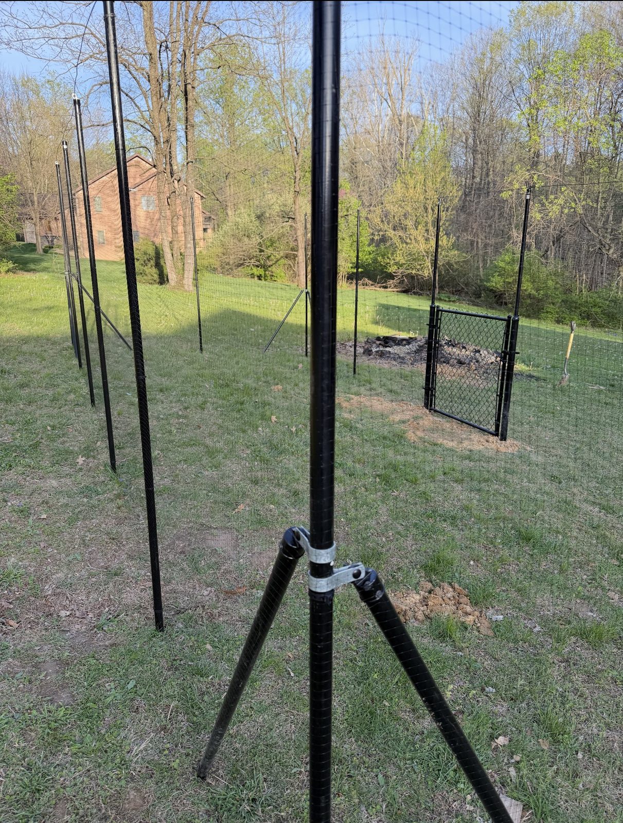 Black welded wire fence with a chain link gate in Bloomington, IN