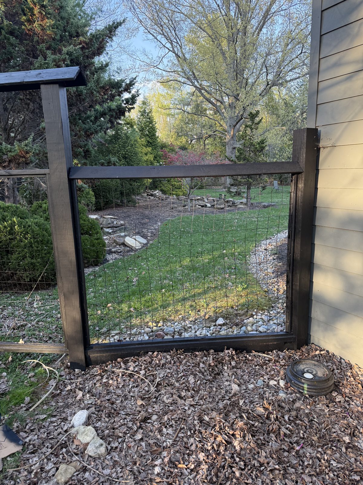 Wood-framed welded wire fence gate installation in Bloomington, IN