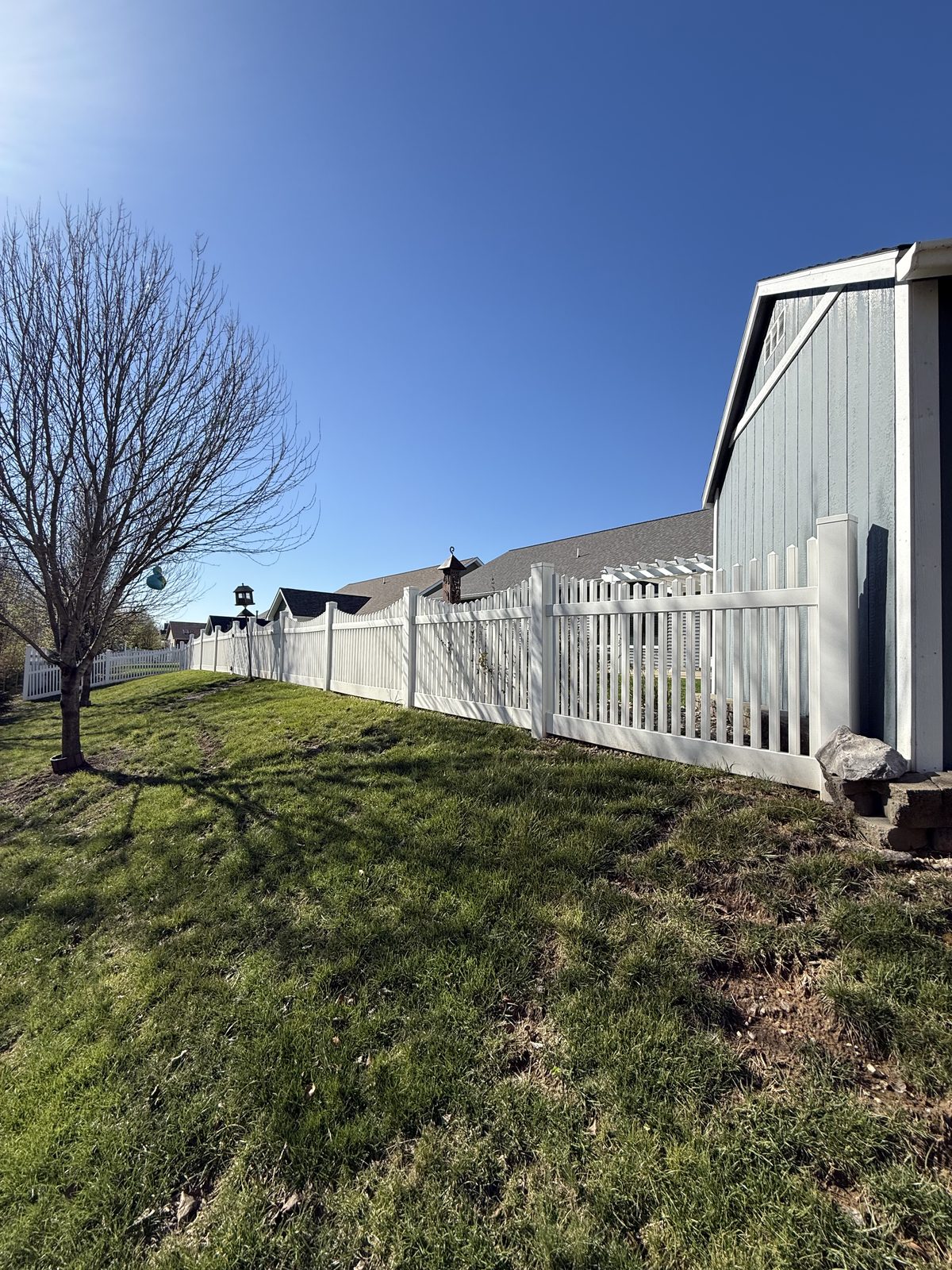 White vinyl picket fence installation in Bloomington, IN