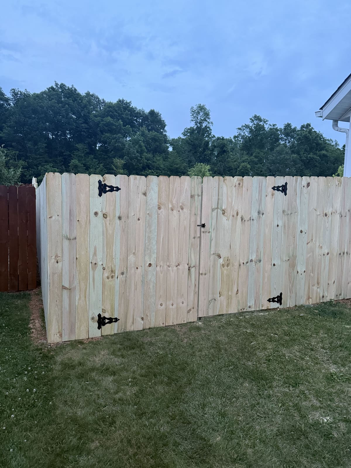 Completed wood fence double gate in Bloomington, IN