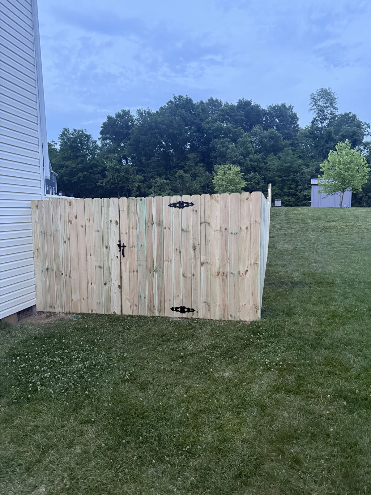 Wood privacy fence corner with gate in Bloomington, IN