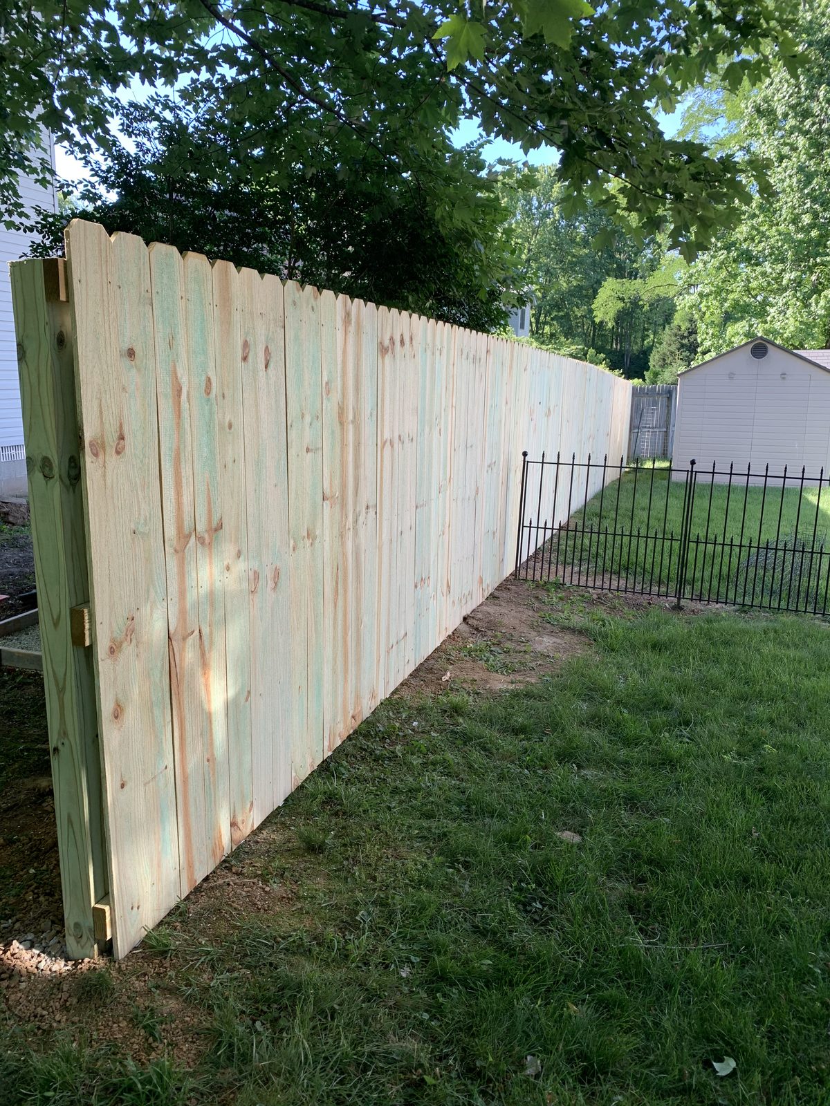 New wood privacy fence panel installation in Bloomington, IN
