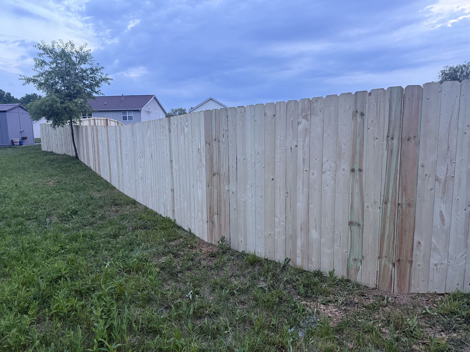 Long run of new wood privacy fence in Bloomington, IN